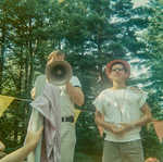 Bruce Hamilton auctioning off Dan Mannis at 1967 Cabintown Fair--Dan begged for someone to outbid the kitchen boys, but they won, requiring him to do KP